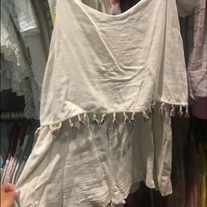 Cream linen romper with colorful tassels